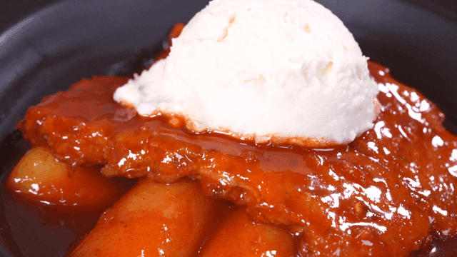 Spicy tteokbokki topped with potato salad