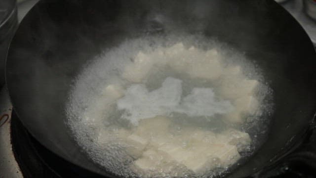 Tofu boiling in a pot