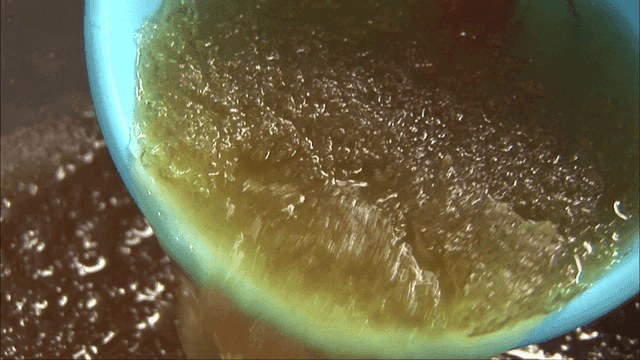 Broth with crushed ice scooped with a dipper