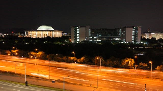 Illuminated Cityscape at Night Viewed from Distance