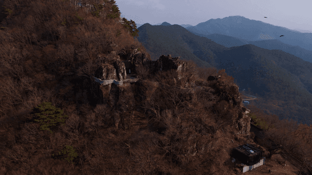 Mountain temple where birds fly