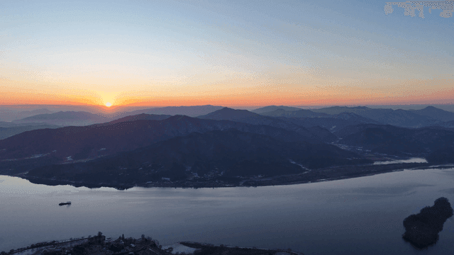 Sunrise over a tranquil mountain range