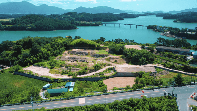 A scenic coastal village with lush greenery