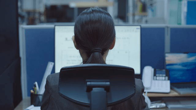 Office worker focused on computer screen
