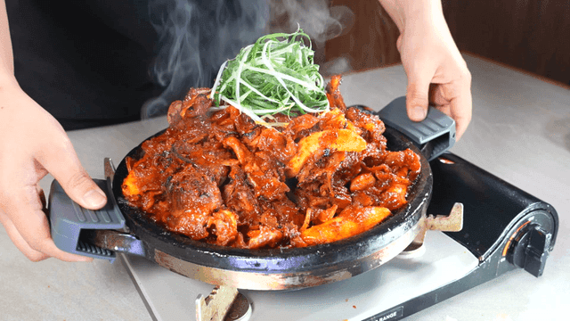 Spicy crunchy braised pork ribs on gas burner