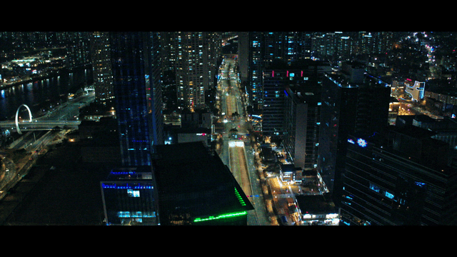 Night view of a bustling city with skyscrapers