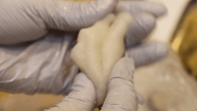 Gluting rice cakes onto stick cookies