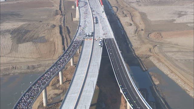 Marathon on a Long Incheon Bridge Over Dry Terrain