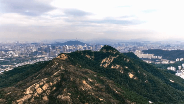 Mountain range with city skyline in view