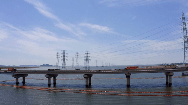Bridge and cars over the blue river