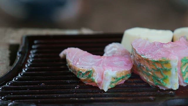 Fresh parrotfish grilled on an outdoor barbecue grill