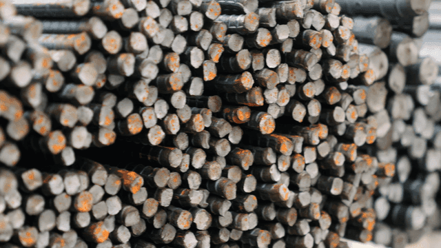 Stacked steel rods with rust spots