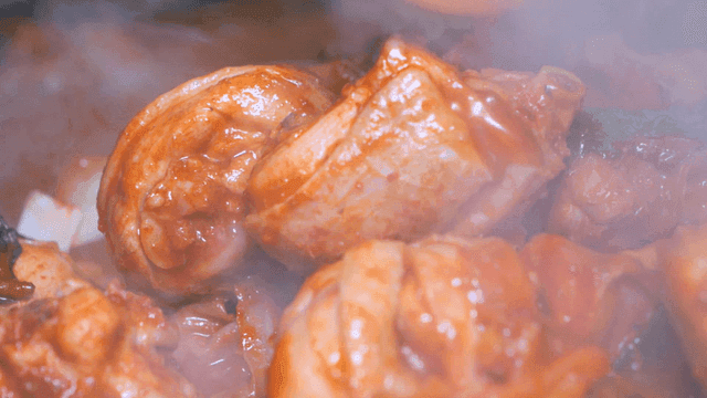 Spicy chicken stew boiling in pot