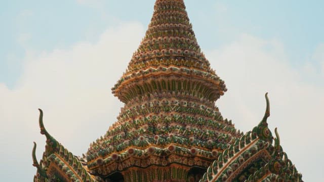 Detailed view of ornate Thai temple architecture outdoors