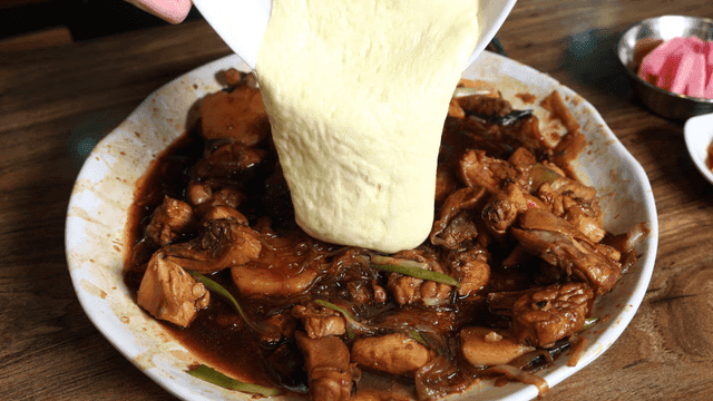 Soy sauce braised chicken with cheese poured over it