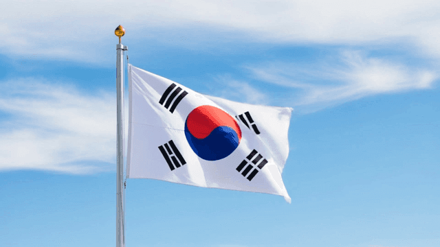 Korean flag waving against a blue sky