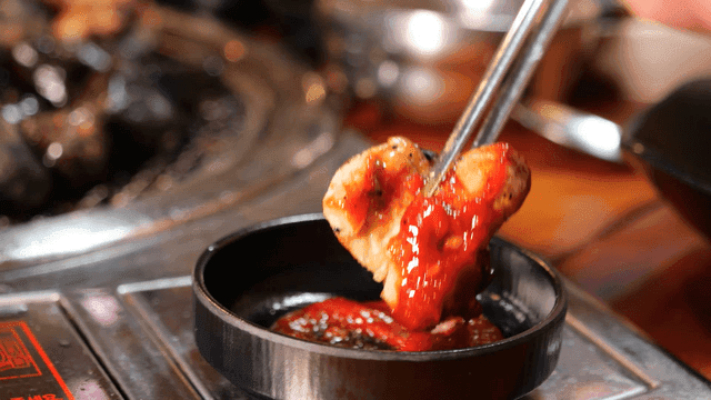 Charcoal-grilled chicken galbi dipped in spicy sauce