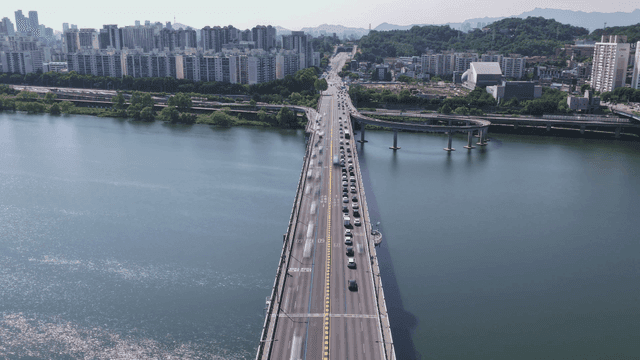 Crowded bridge over city river