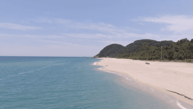 A serene beach with gentle waves