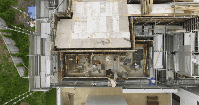 Construction site with workers and scaffolding