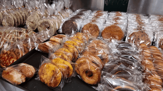 Packaged breads arranged on bakery tray