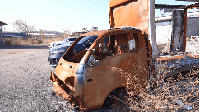 Burnt truck in parking lot