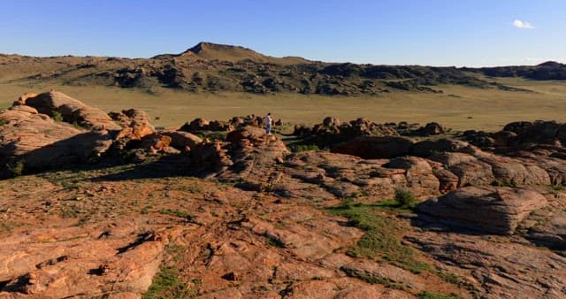 Person standing on rocky terrain