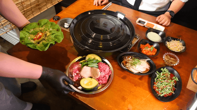 Korean barbecue meal served with side dishes