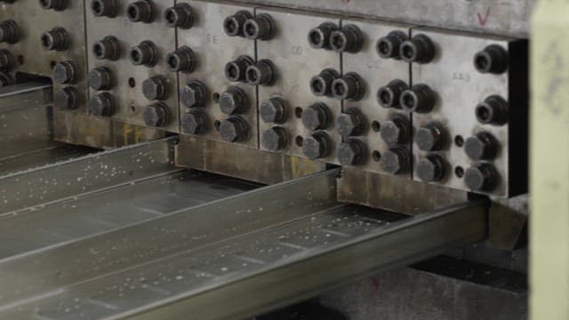 Metal sheets being processed in a factory