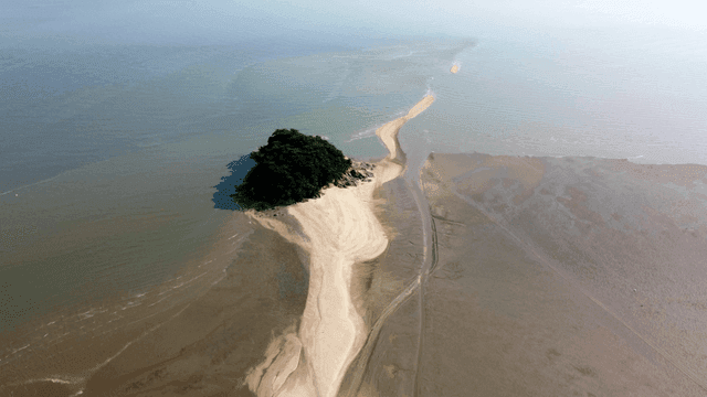 Small island surrounded by calm sea