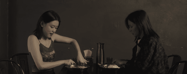 Two women enjoying a meal together