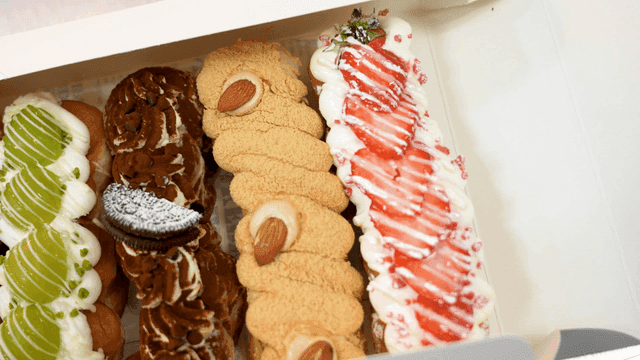 Box containing donuts of various colors