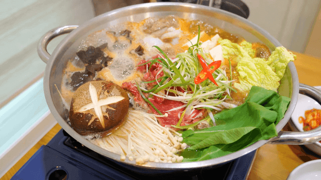 Red pepper paste beef bulgogi hot pot filled with mushrooms and vegetables