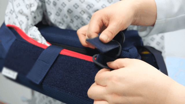 Adjusting medical armrest in hospital