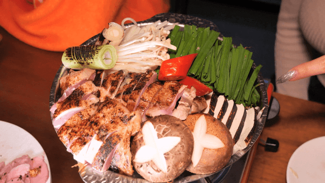 Chicken stew with vegetables on gas burner
