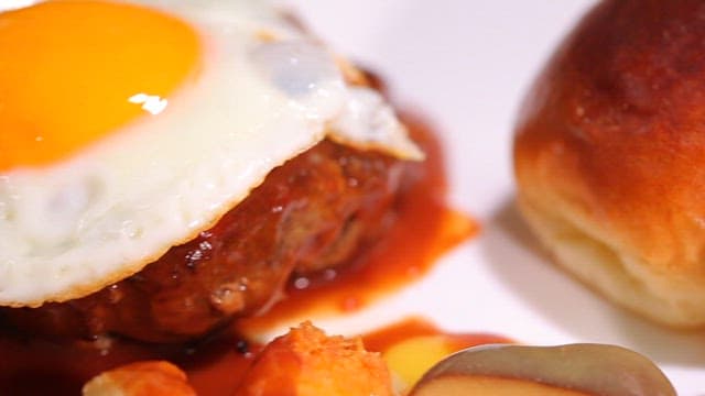 Hamburger steak topped with a fried egg