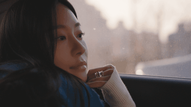 Woman gazing out of a taxi window