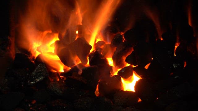 Burning coals with bright flames