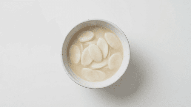 Steaming bowl of rice cake soup