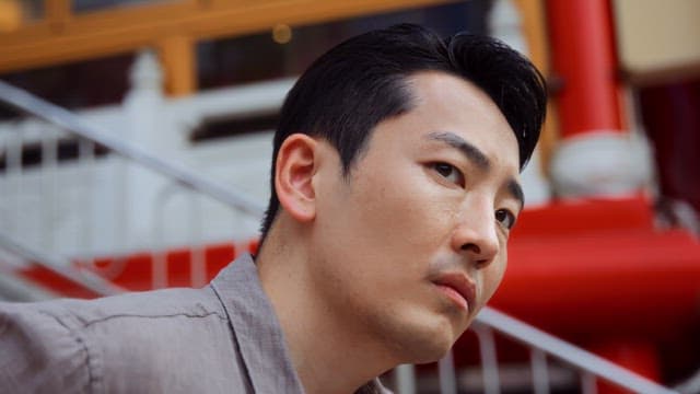 Man looking around on outdoor stairs