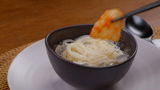 Appetizing cold noodles served with kimchi