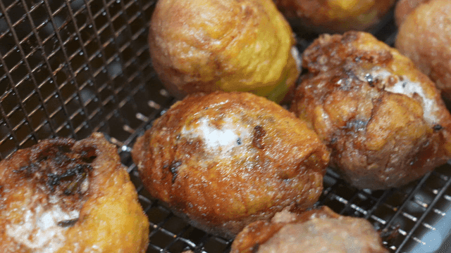 Golden chicken skin dumplings in deep fryer
