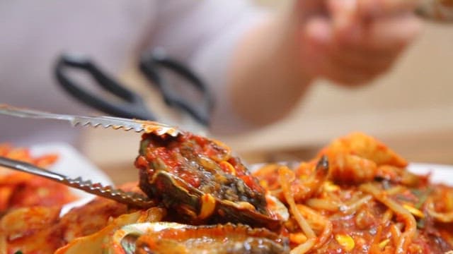 Spoonful of abalone from the spicy braised seafood