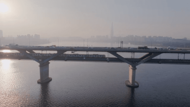 Bridge over a river with city skyline