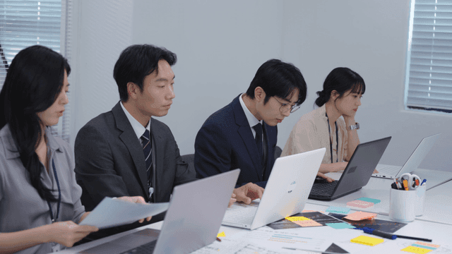 Business meeting with laptops and documents