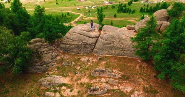 Person standing on a rocky mountain