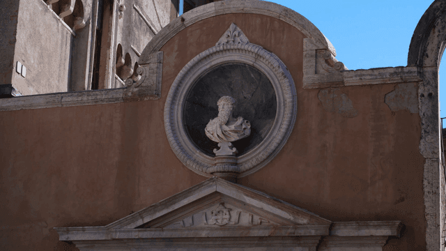 Historic building facade with a sculpture