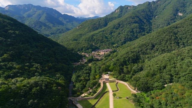 Scenic village surrounded by lush green mountains