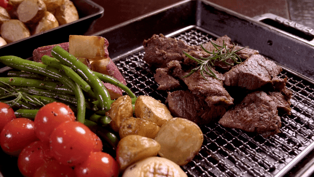 Grilled steak with vegetables on a tray