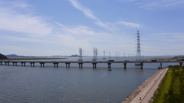 Bridge and cars over the blue river